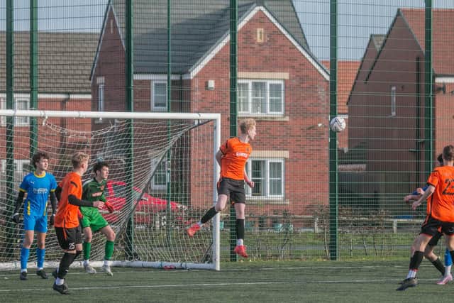 Fin Shevlane heads the ball clear for Nene Valley during their 4-2 defeat at RTC in an Under 18 League match. Photo: Charlotte Edwards.