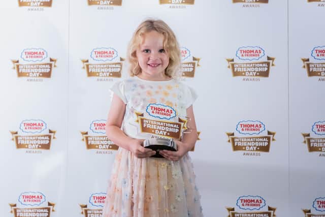 Grace Prior, 4, from March, with her award.