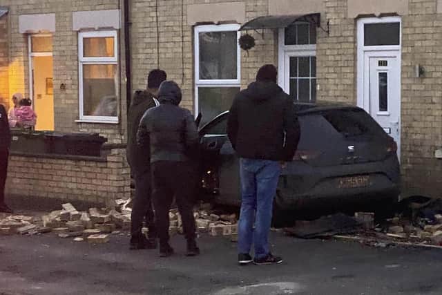 The car destroyed a wall on Elmfield Road, Dogsthorpe. Photo: Malcolm Smart.