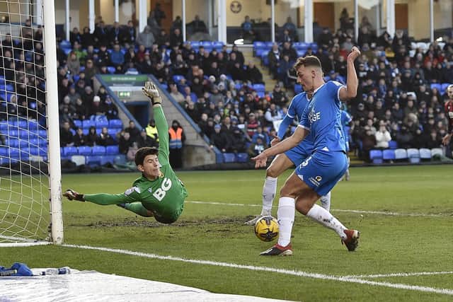 Harrison Burrows tees up Hector Kyprianou for the first Posh goal v Oxford. Photo: David Lowndes.