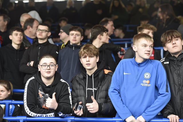Peterborough United fans watch the defeat against Bolton Wanderers.