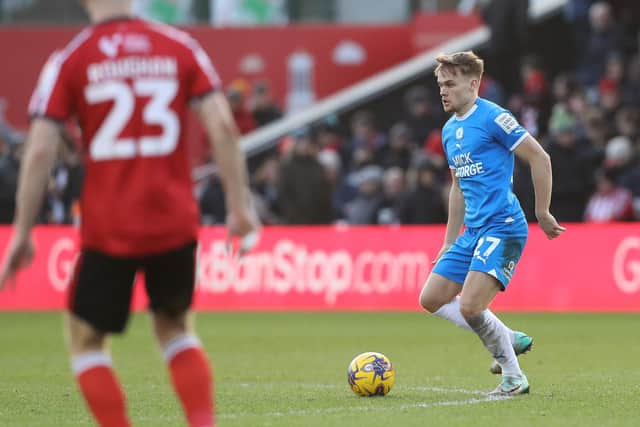 Archie Collins of Peterborough United in action against Lincoln City. Photo: Joe Dent/theposh.com.