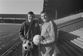Former Peterborough United manager Noel Cantwell (1932-2005) pictured on right with forward John Cozens at London Road on 2nd December 1973.