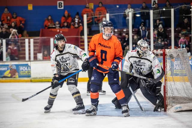 Phantoms star Lukas Sladkovsky is sandwiched by two MK players. Photo: SBD Photography.