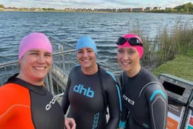 Open water swim training: Liza Raby, centre, pictured with her hairdressing business partner Hannah Lowndes, right, and client Sarah Brown.