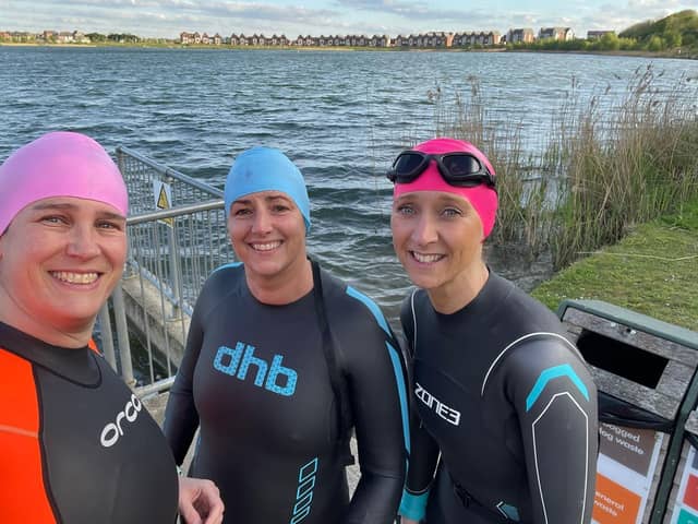 Open water swim training: Liza Raby, centre, pictured with her hairdressing business partner Hannah Lowndes, right, and client Sarah Brown.
