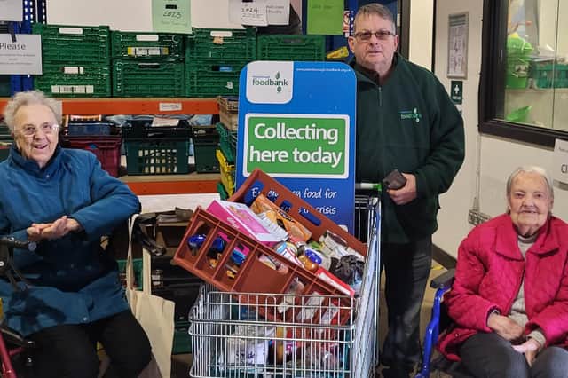 Hampton Grove residents present their donations to the Trussell Trust.