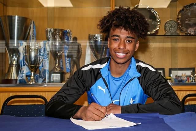James Dornelly signs a Professional Development contract at Posh. Photo: Joe Dent/theposh.com.
