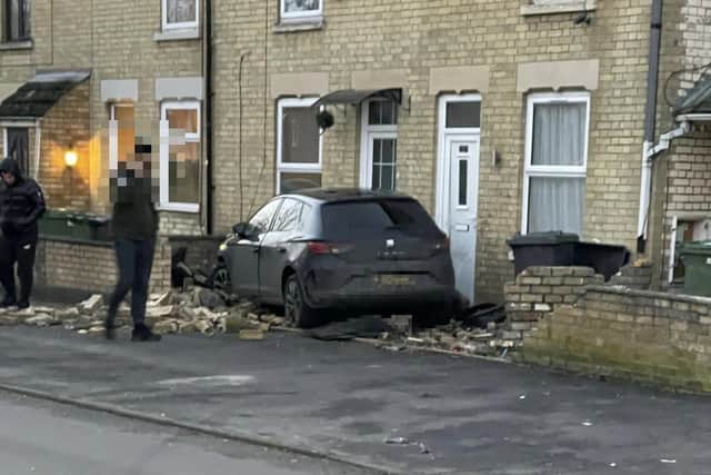 The car destroyed a wall on Elmfield Road, Dogsthorpe. Photo: Alasdair McIntosh.