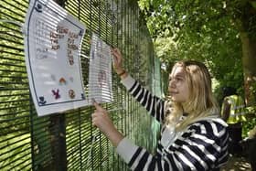 Fletton and Woodston ward councillor Daisy Blakemore-Creedon hanging signs designed by pupils at the school.