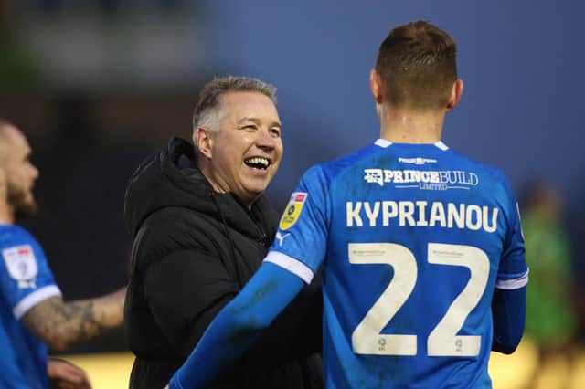 Darren Ferguson celebrates victory over Forest Green with Hector Kyprianou. Photo: Joe Dent.
