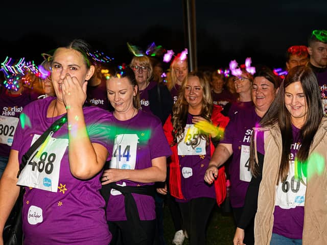 Walkers donned glow in the dark accessories and neon face paints as they set off from Ferry Meadows County Par. Photo: Matt Jeffery Photography