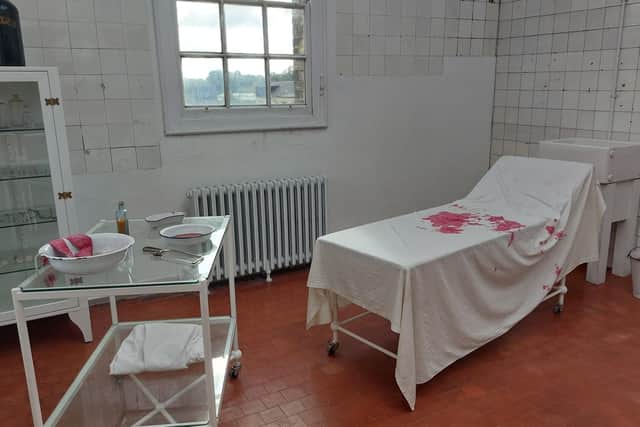 The building's old Victorian operating theatre, replete with blood-soaked bedsheets