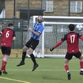 Cardea FC (blue) in action earlier this season. Photo David Lowndes.