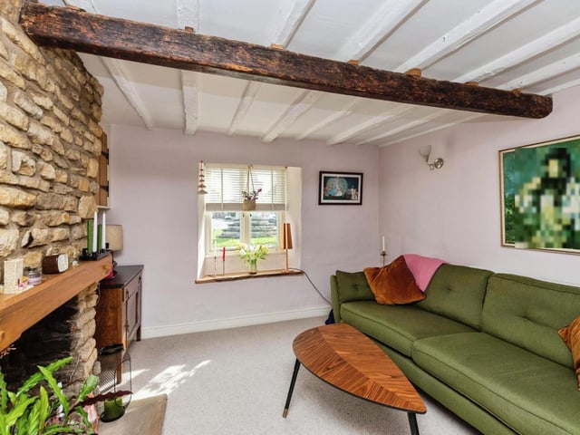 The cottage has features including period beams