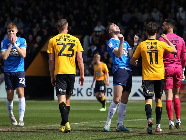 Posh midfielder Jack Taylor after missing a great chance to score at Cambridge United. Photo: Joe Dent/theposh.com