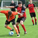 Action from Thorney's 4-0 win at Netherton A (red) at the Grange. Photo David Lowndes.