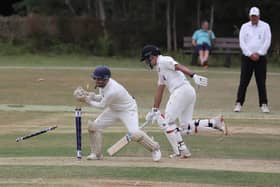 Peterborough Town's Bashrat Hussain is safely home in the game at Geddington. Photo Andy Dann