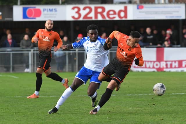 Dion Sembie-Ferris (orange) in action for Sports against Tamworth. Photo: David Lowndes.