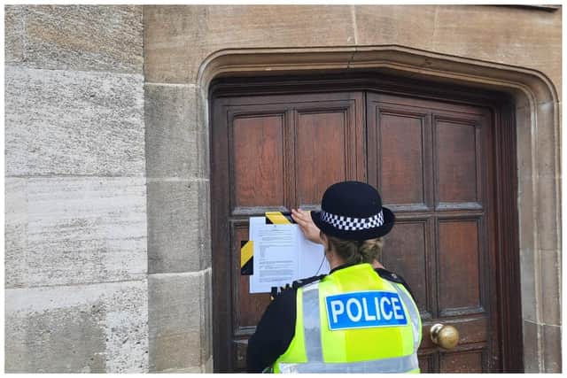 Police serve the order at the flat