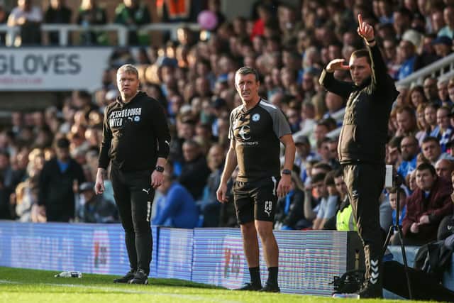 Rival managers Grant McCann (left) and Mark Bonner (right) at London Road last weekend. Photo: Joe Dent/theposh.com.