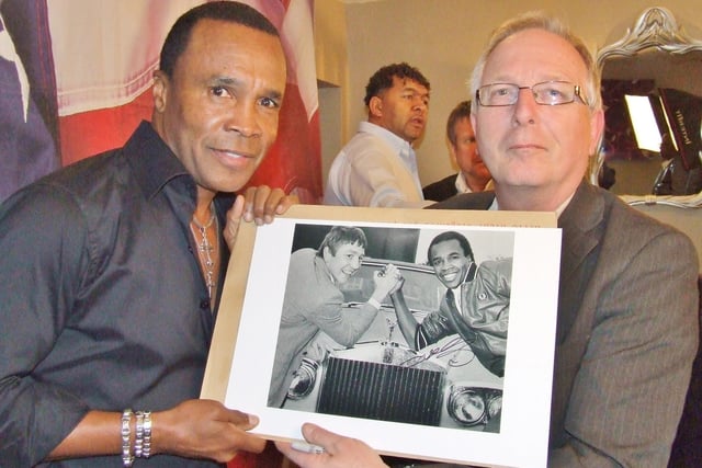 Sugar Ray Leonard with the picture David took of him years before with Dave Boy Green, the Fen Tiger. Sugar Ray asked David for a copy to hang at his home in the States.