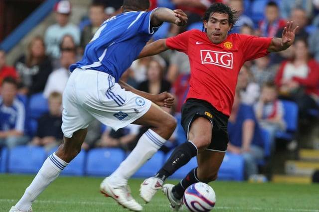Carlos Tevez looks to take on Shane Blackett during the pre-season friendly match between Posh and Manchester United on August 4 2008.