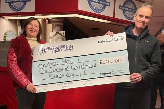 Werrington Joggers chairman Rod McDonald presents a cheque for £1,200 to Carole Hughes, trustee of Anna’s Hope Charity.