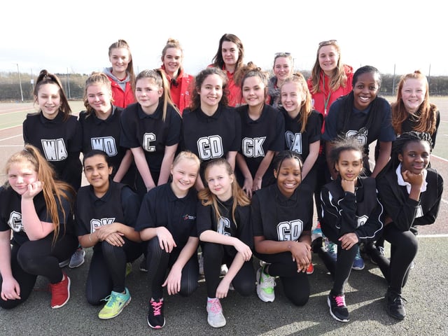Pictured are the AMVC event leaders with teams from Thomas Deacon Academy during a netball tournament at the college.