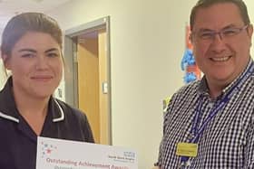 Amy Dewhurst receives her award from the North West Anglia NHS Foundation Trust.