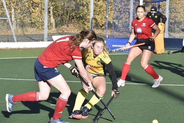Hockey action from City of Peterborough Ladies (red) v Norwich City. Photo: David Lowndes.