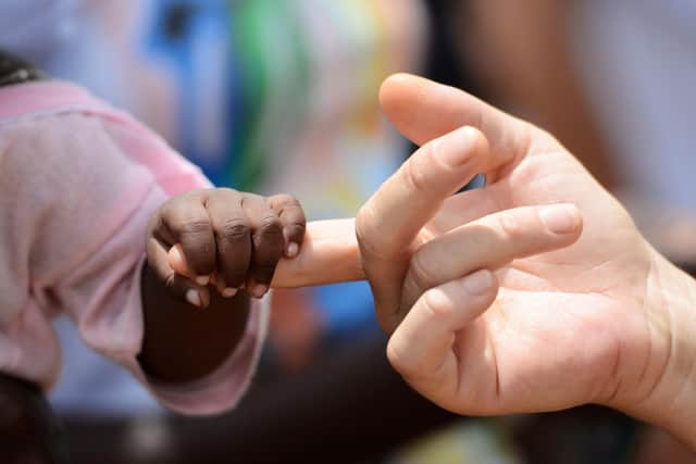 Fostering has been described as a "really rewarding role" which makes a massive difference to vulnerable children and young people. (image: Adobe).