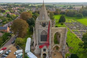 The striking drape is 20 metres high and contains 6,000 hand made poppies. Photo: Peterborough From Above