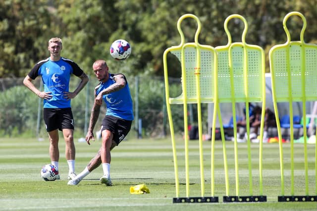 Joe Ward practices free-kicks after training