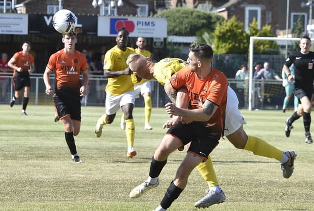 Local football action from Peterborough Sports (orange) v Brackley Town. Photo: David Lowndes.