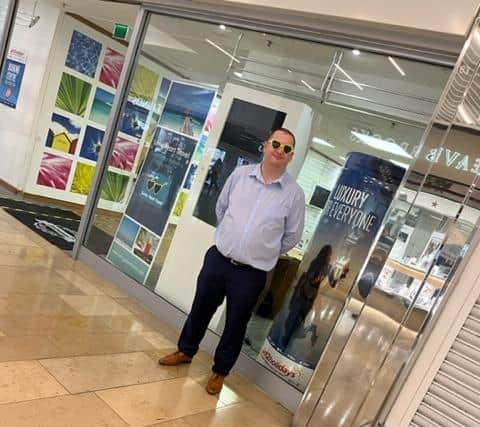 Aaron Lake, branch manager for Sunny Heart Travel, in Queensgate Shopping Centre,  Peterborough.
