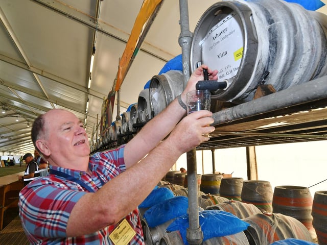 Volunteer staff Robert Sprouce behind the bar