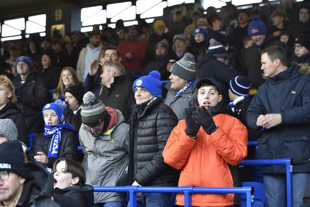 Peterborough United fans watch the 2-1 FA Cup win over Doncaster Rovers.