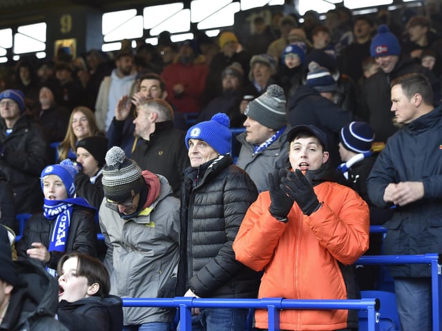 Peterborough United fans watch the 2-1 FA Cup win over Doncaster Rovers.