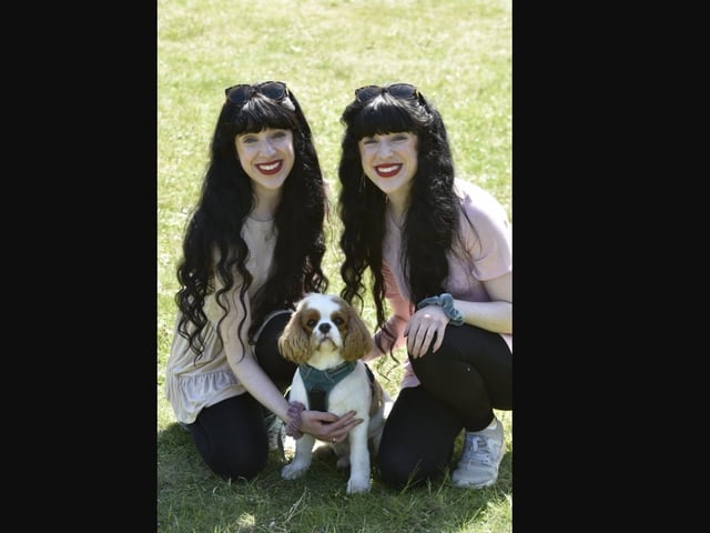 Classical Reflection singers Hannah and Naomi Moxon and their dog Wally visiting the event