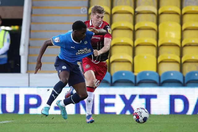 Kwame Poku of Peterborough United battles with Dean Campbell of Stevenage. Photo: Joe Dent/theposh.com