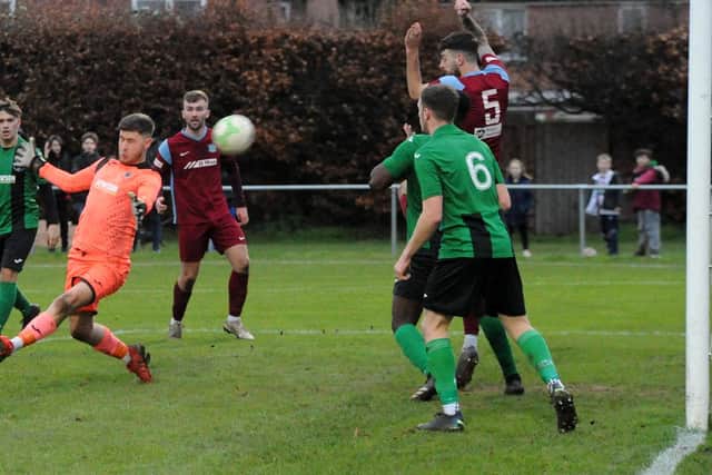 Robbie Ellis shoots at goal for Bourne v Blackstones.