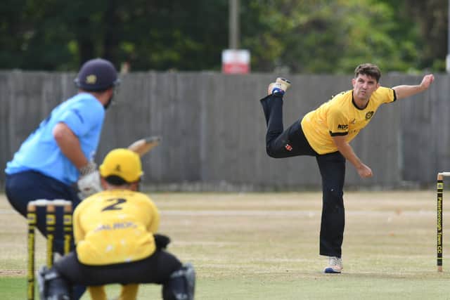 Lewis Bruce bowling for Peterborough Town against Geddington. Photo: David Lowndes.
