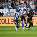 Kwame Poku of Peterborough United in action with Reece James of Sheffield Wednesday. Photo: Joe Dent/theposh.com.