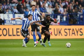 Kwame Poku of Peterborough United in action with Reece James of Sheffield Wednesday. Photo: Joe Dent/theposh.com.