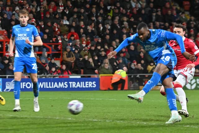 Bradley Ihionvien scores for Peterborough United against Wrexham in the semi-final of the Vertu Trophy. Photo: David Lowndes.