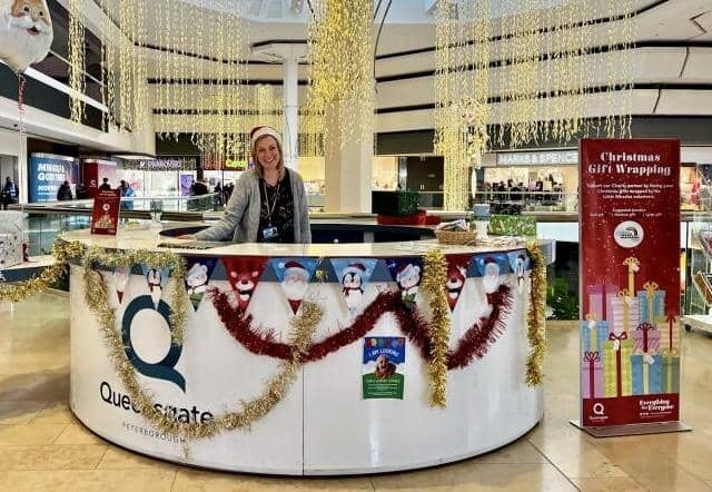 A representative of Little Miracles at the charity's Christmas gift wrapping station in the Queensgate Shopping Centre.