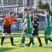 Peterborough Sports joint manager Michael Gash (orange) is not happy as the referee brandishes a red card in the direction of Ryan Fryatt. Photo David Lowndes.
