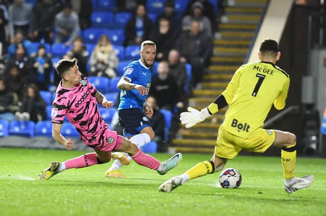 A shot from Posh star Joe Ward is saved by Forest Green 'keeper Luke McGee. Photo: David Lowndes.