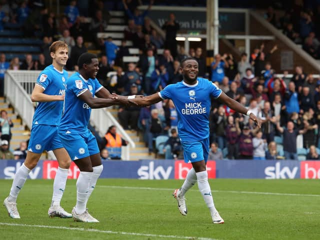 David Ajiboye of Peterborough United celebrates scoring his goal with team-mates. Photo: Joe Dent.